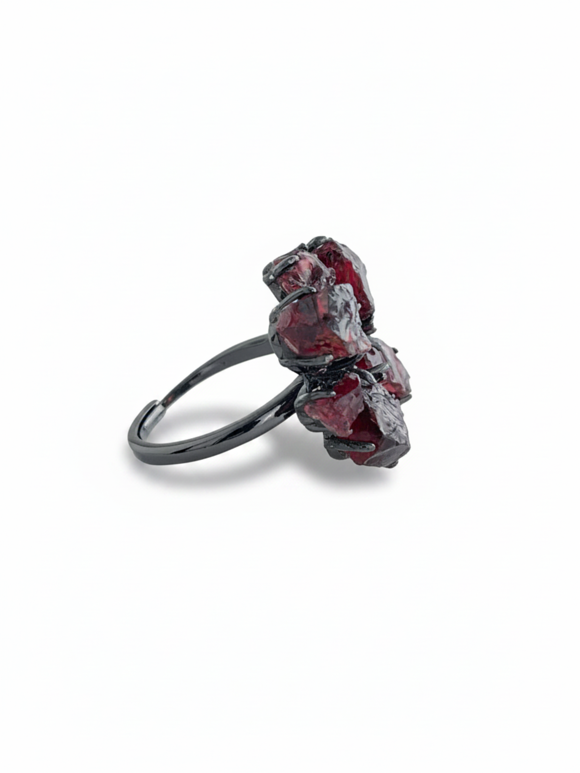Side view of raw garnet snowflake ring showing natural garnet texture and gunmetal-tone setting