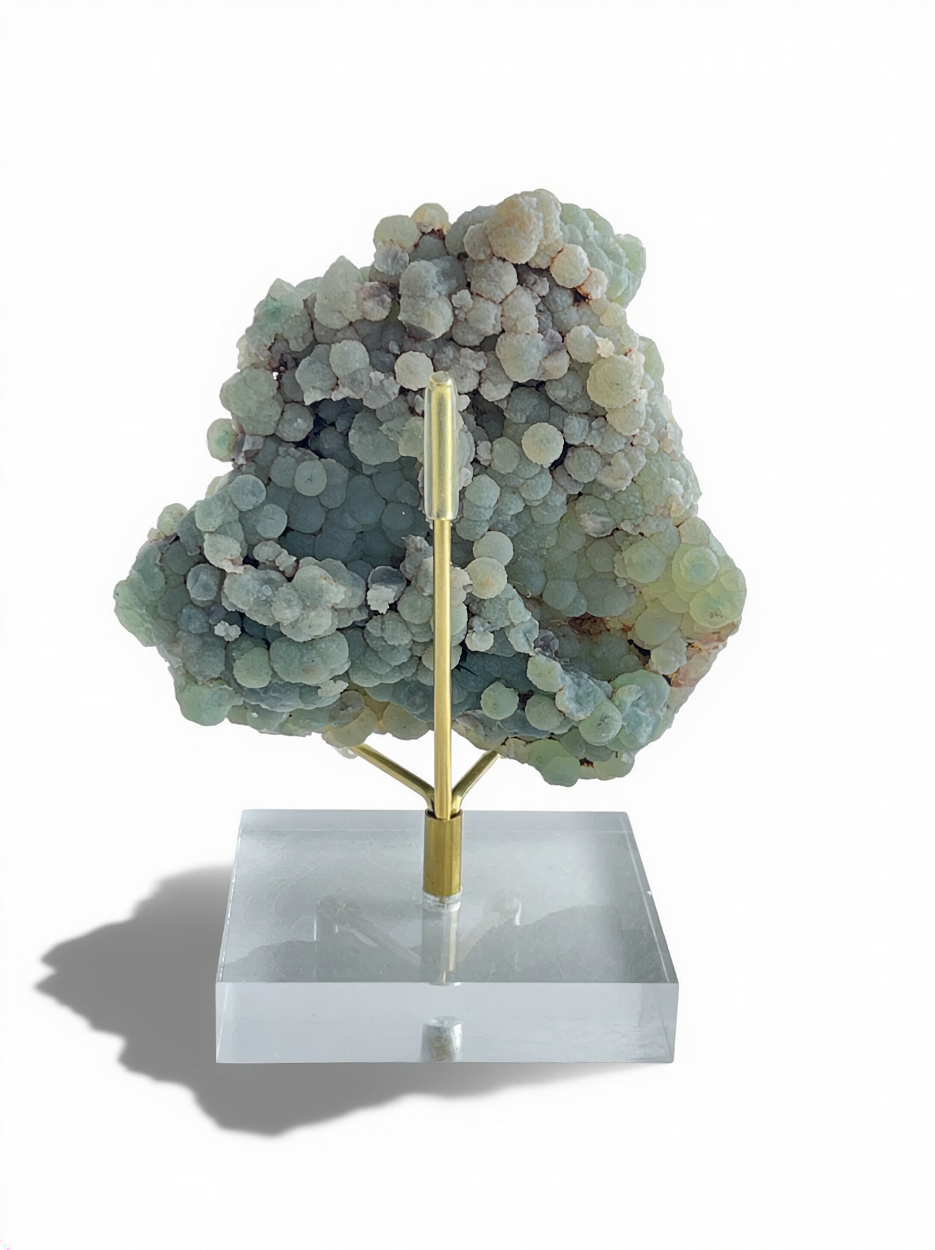 Back view of raw green prehnite cluster mineral specimen from Morocco on display stand
