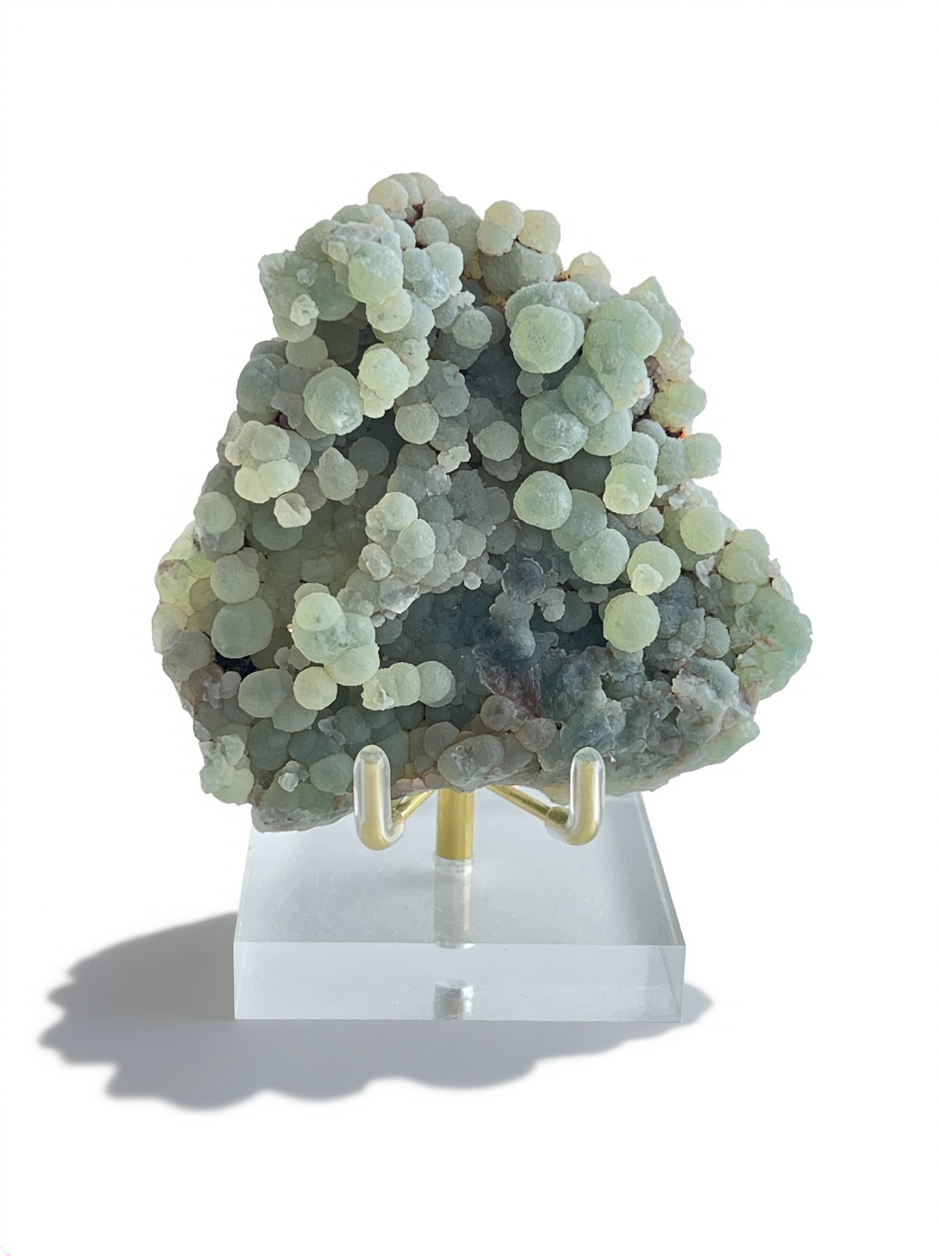 Raw green prehnite cluster mineral specimen from Morocco with display stand, front view