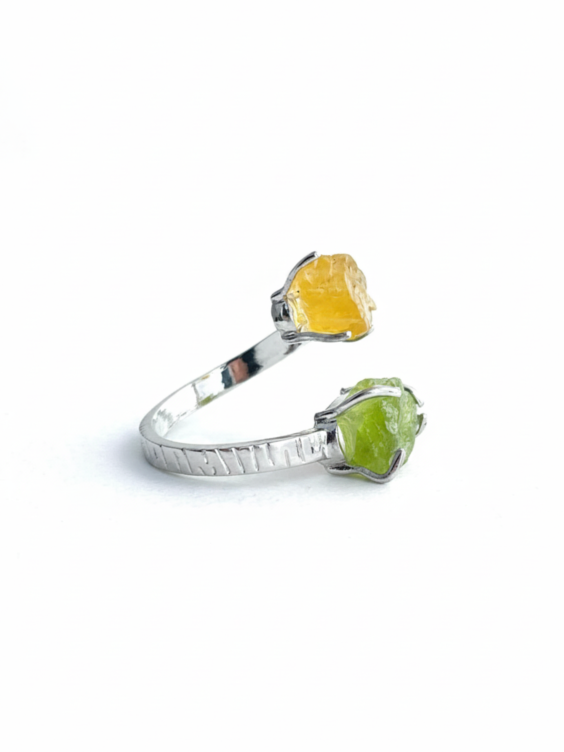 Side view of raw Peridot and Citrine open ring