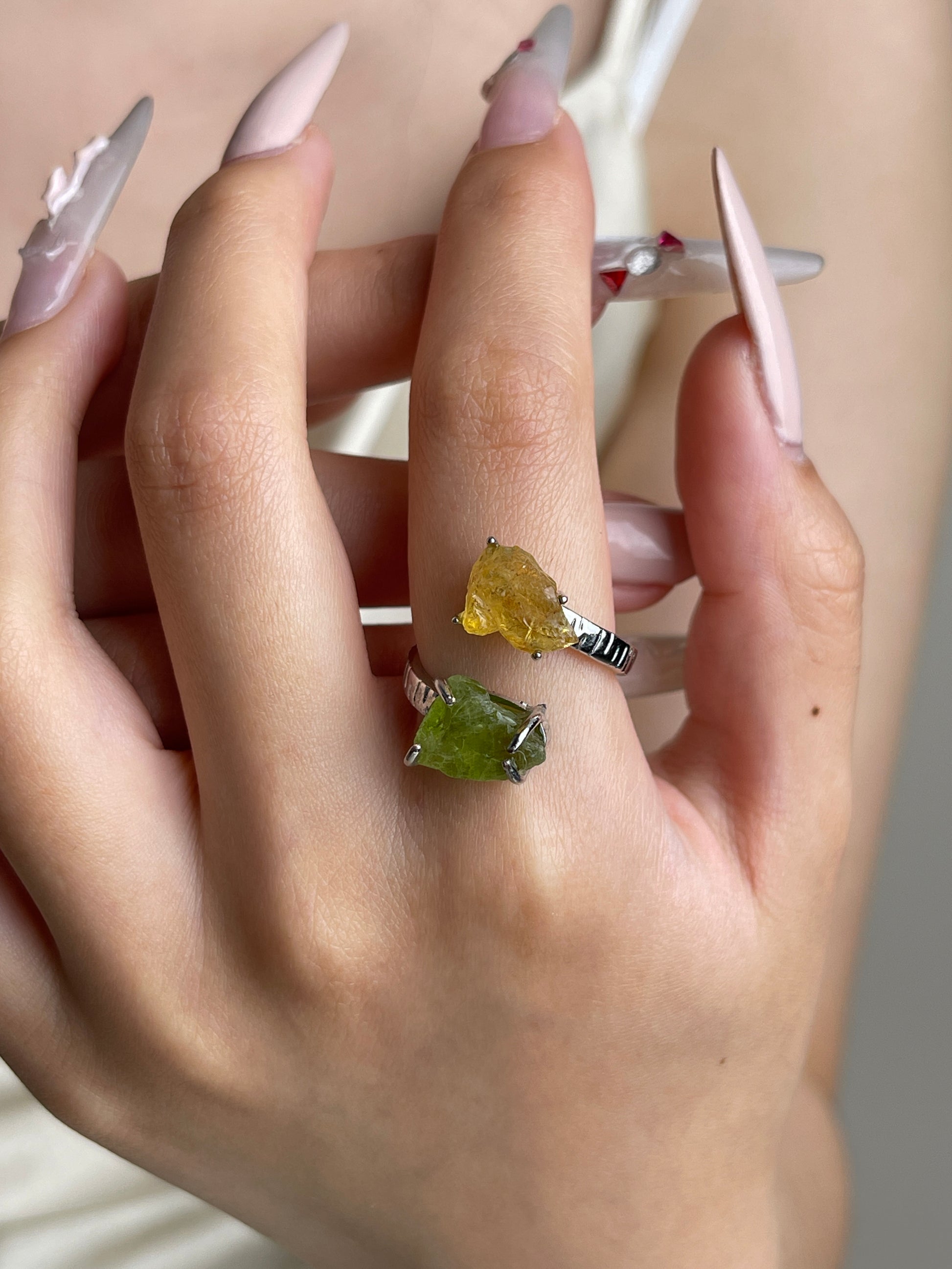 Raw Peridot and Citrine open ring worn on hand