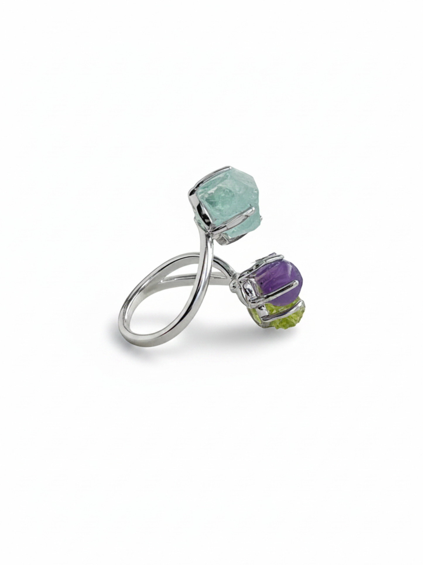 Side view of raw peridot, purple grape agate and raw aquamarine ring with silver tone band