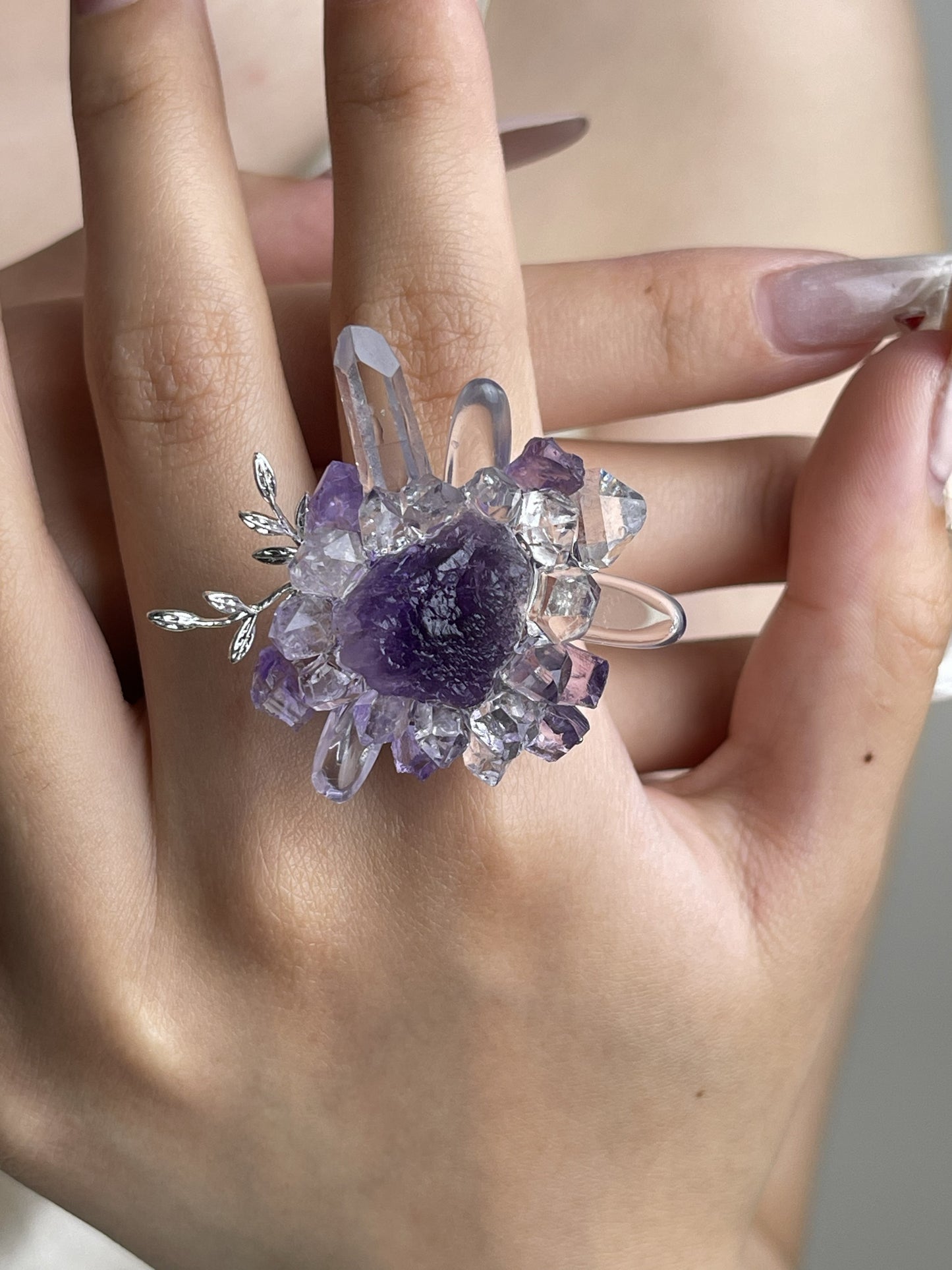 Raw Purple Fluorite, Amethyst and Herkimer Diamond Quartz crystal ring worn on hand