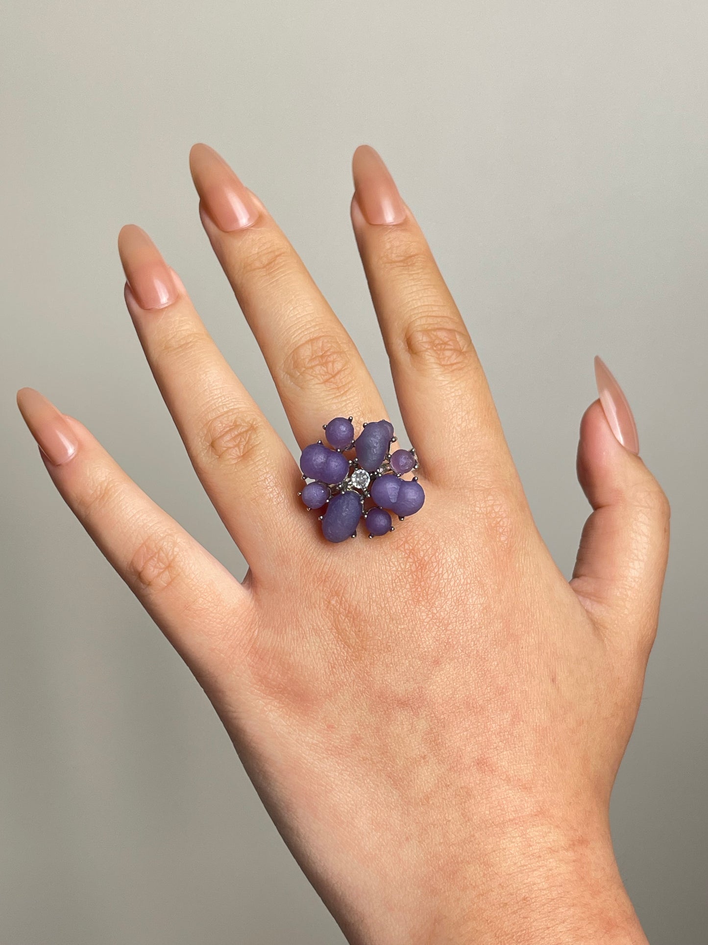 Raw purple grape agate cluster ring worn on hand