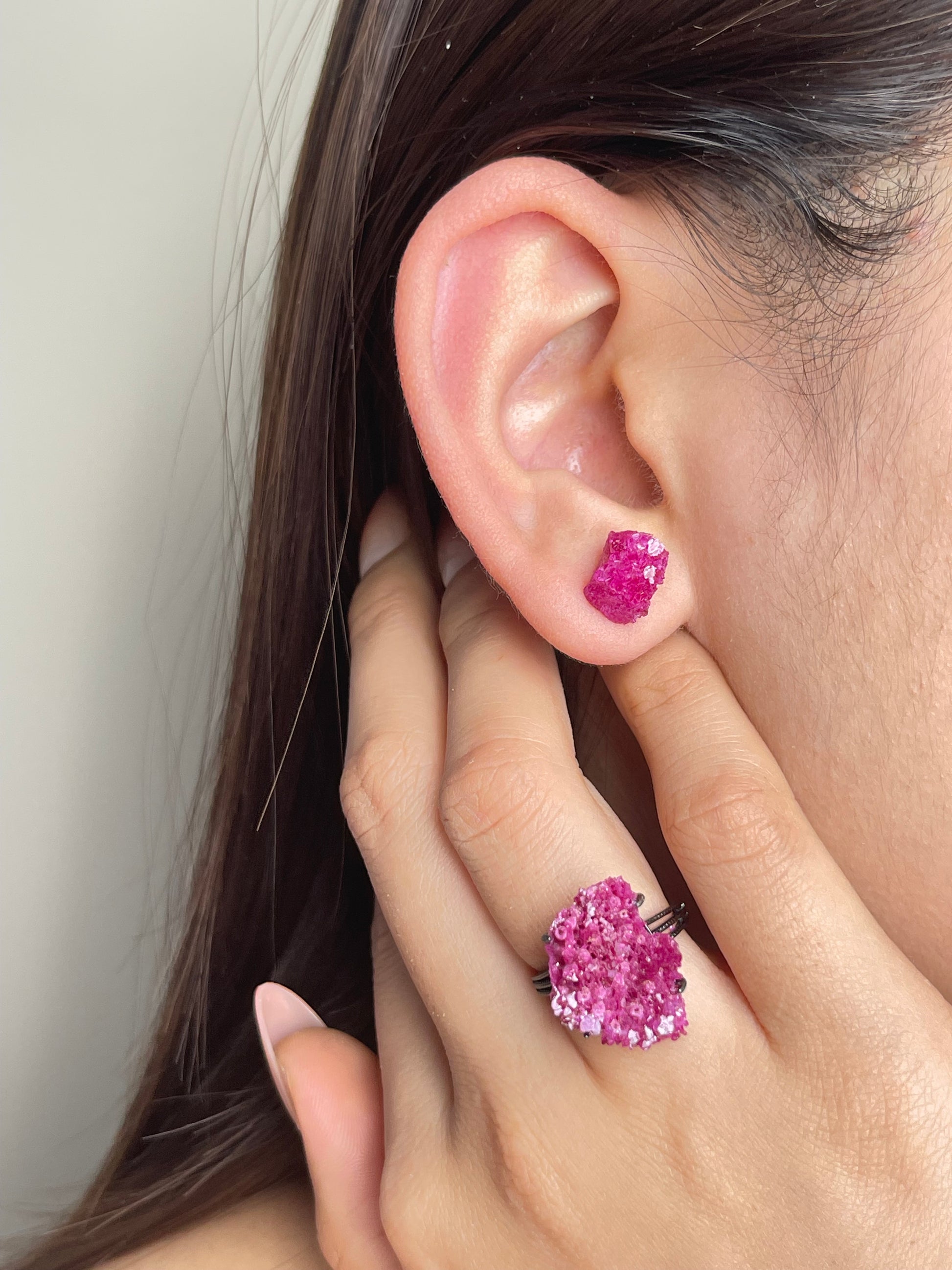 Raw Red Corundum Stud Earrings worn on ear