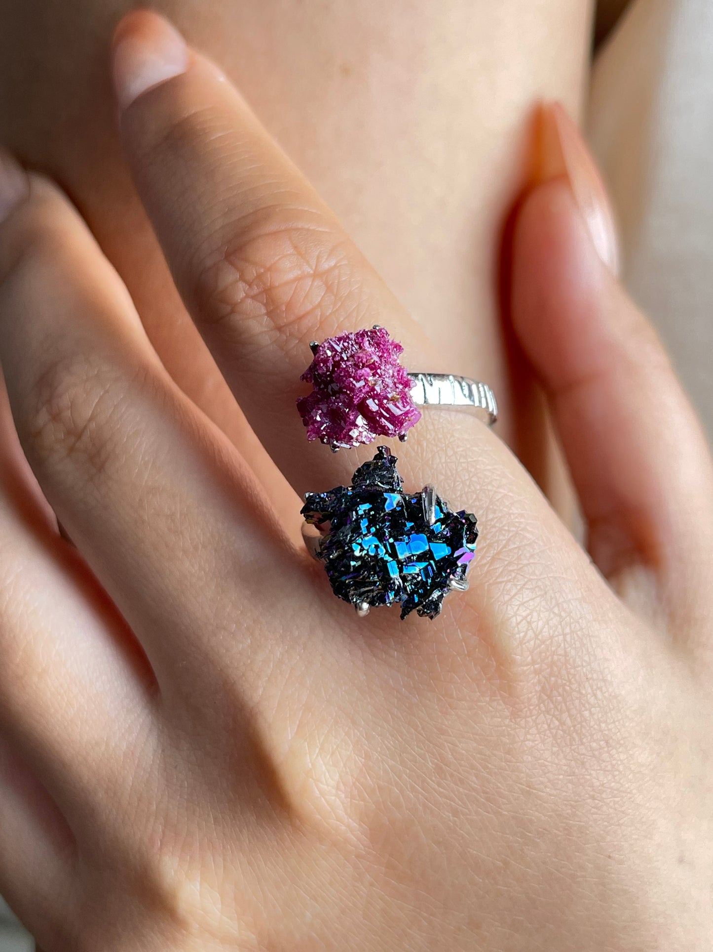 Close-up hand shot of raw ruby and carborundum ring