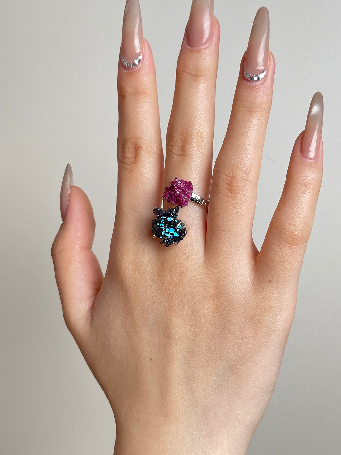 Hand shot of raw ruby and carborundum ring
