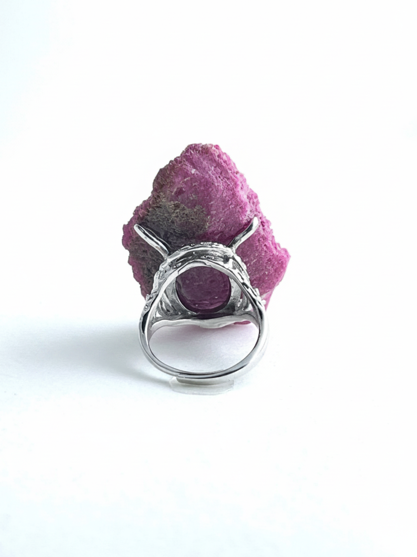 Back view of raw Ruby Red Corundum ring setting and crystal structure