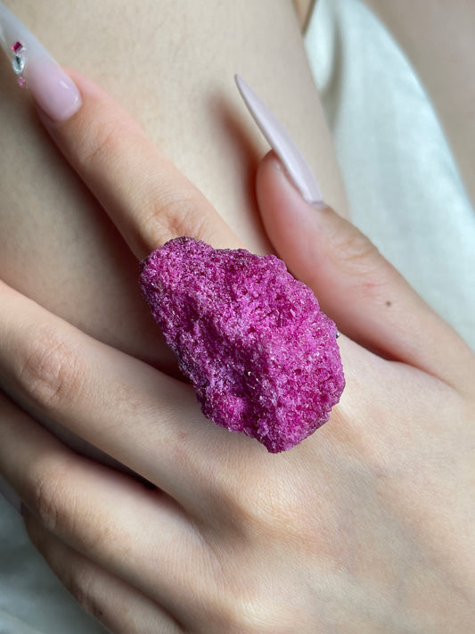 Close-up hand view of raw Ruby Red Corundum mineral specimen ring