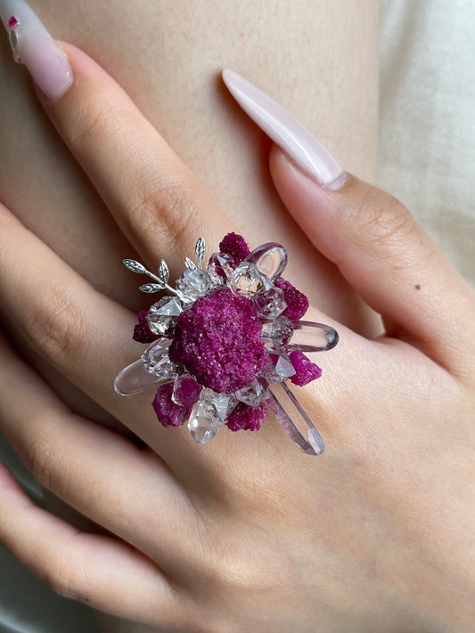 Close up of raw ruby Herkimer Diamond Quartz and clear quartz flower ring worn on hand