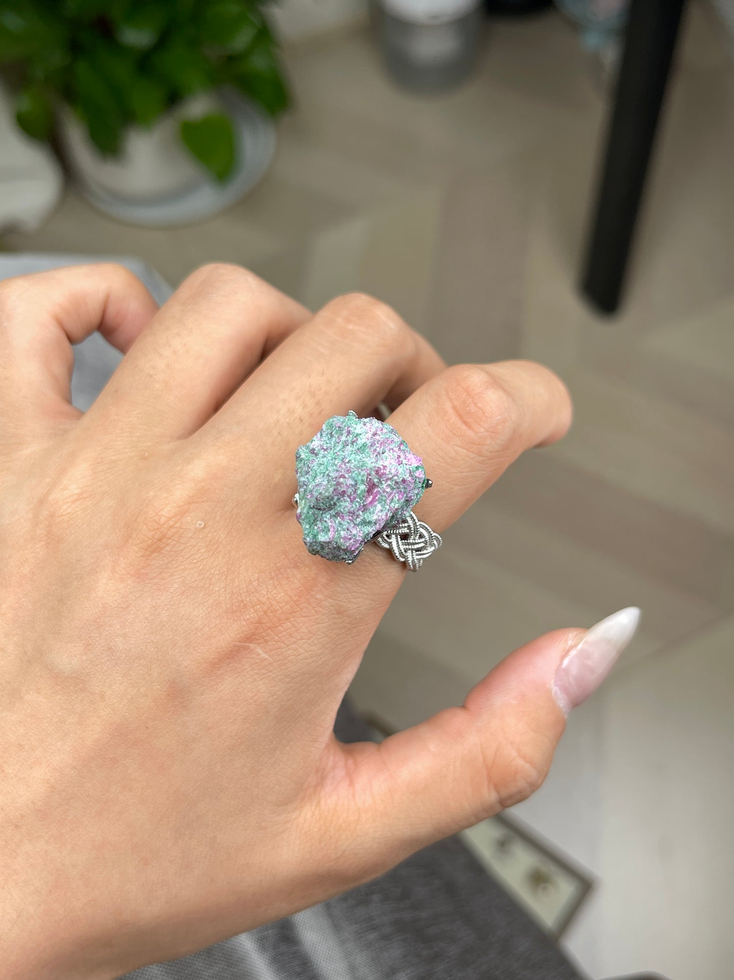 Ruby in fuchsite raw crystal ring close-up on hand