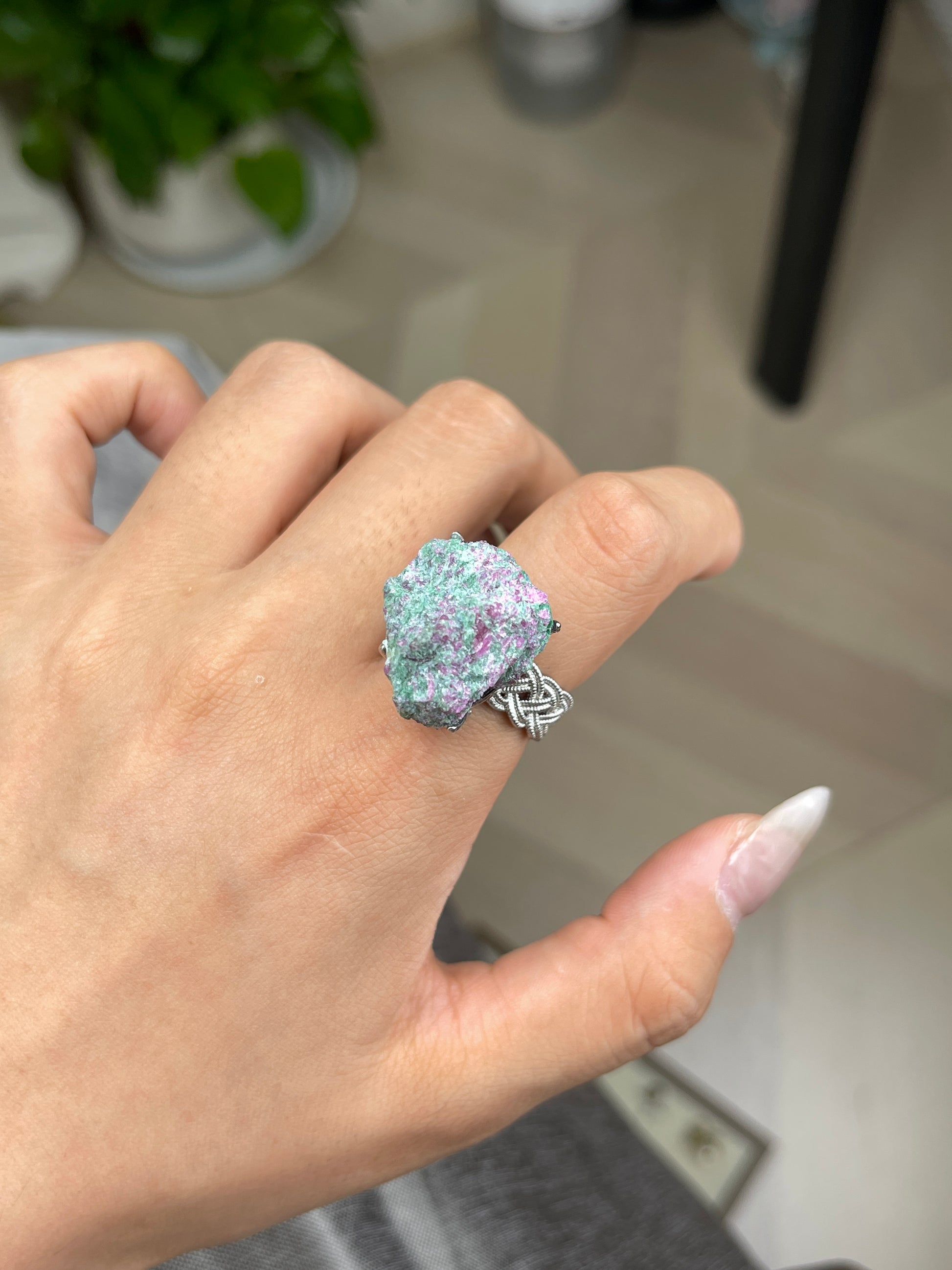 Ruby in fuchsite raw crystal ring close-up on hand