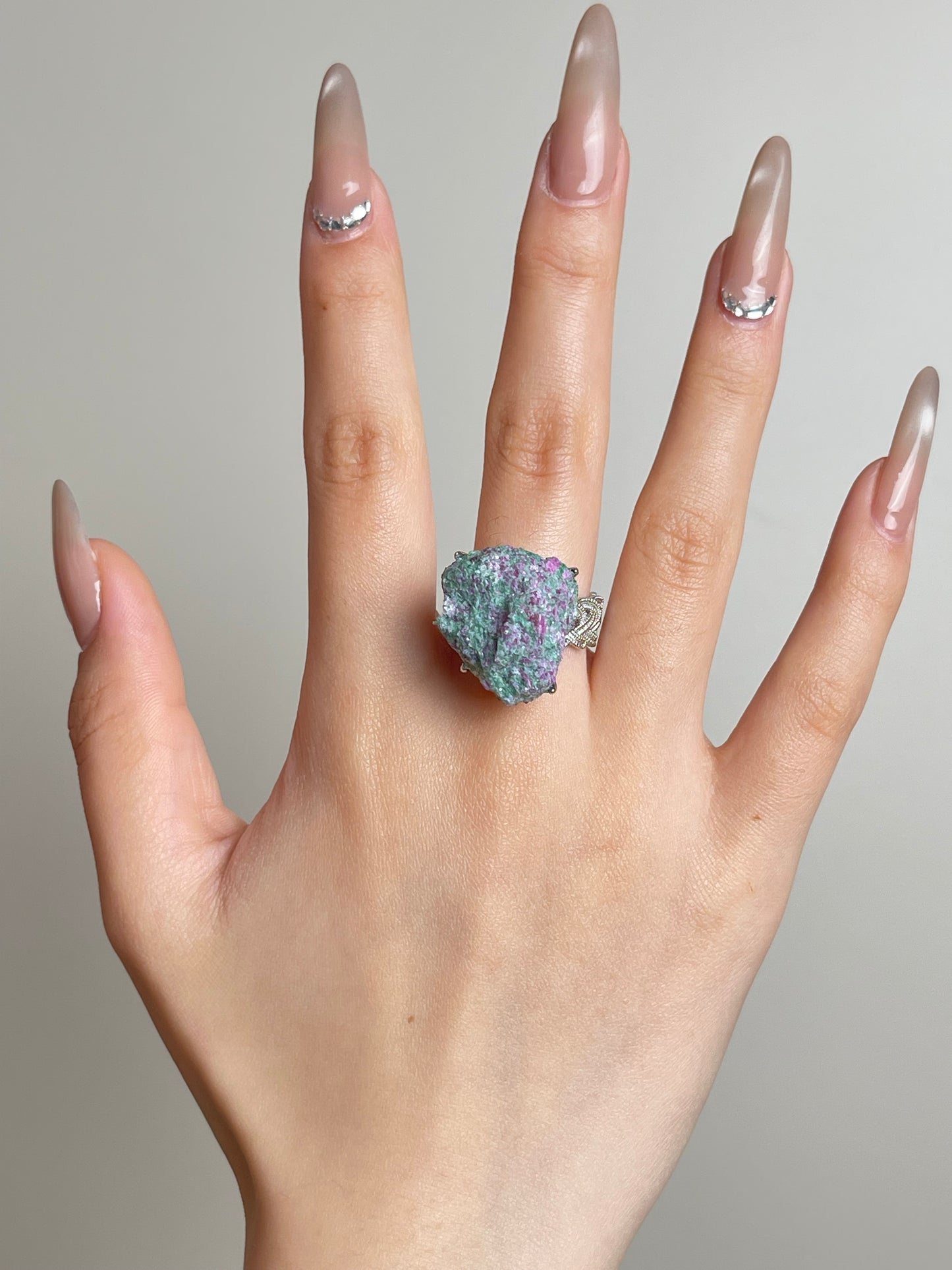 Ruby in fuchsite raw crystal ring worn on hand