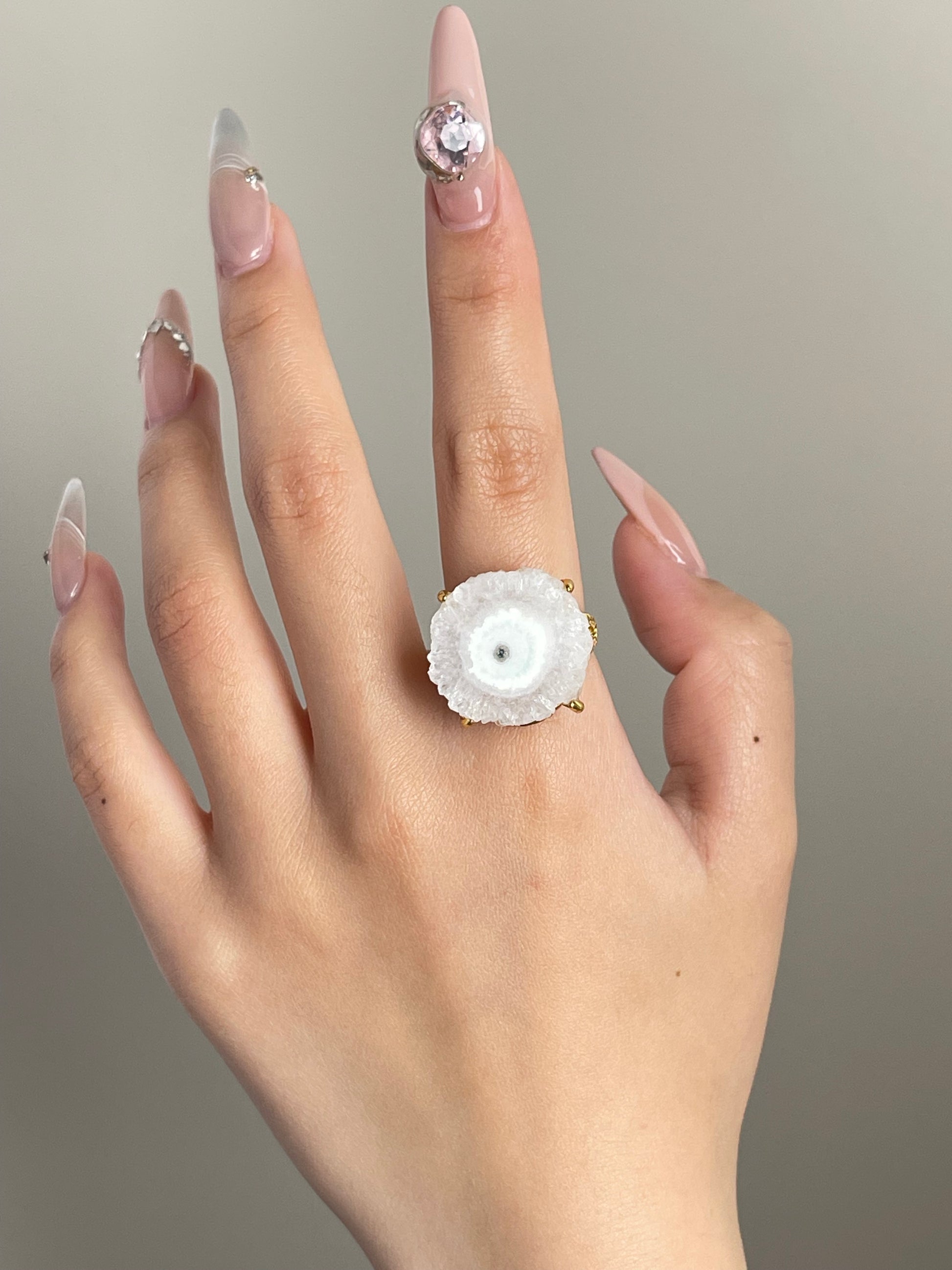 solar quartz crystal slice ring worn on hand by oryssia