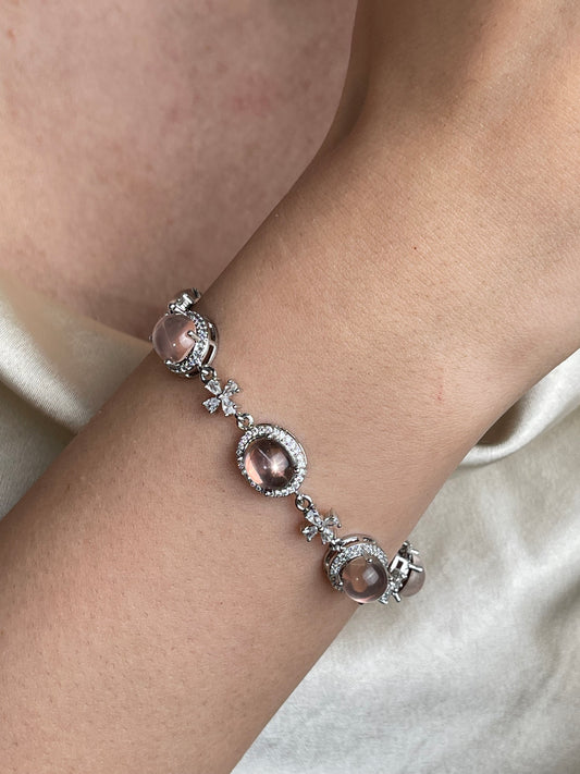 Close-up of star rose quartz bracelet showing asterism effect