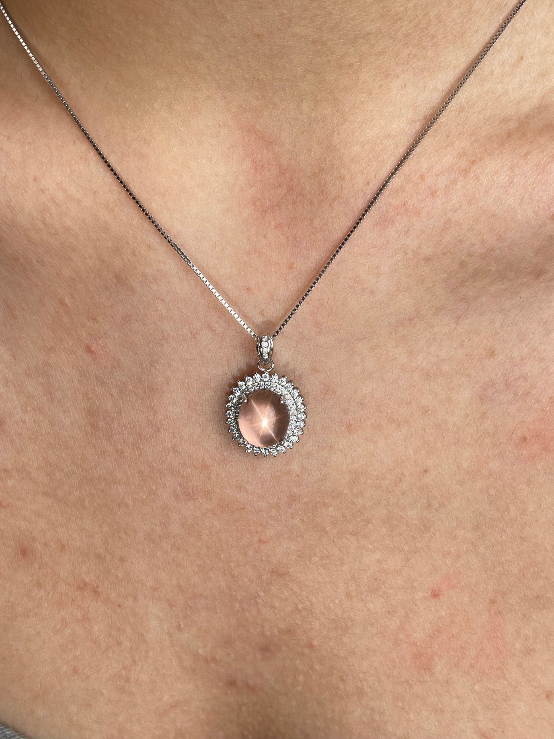 Close-up of star rose quartz necklace Madagascar worn on neck