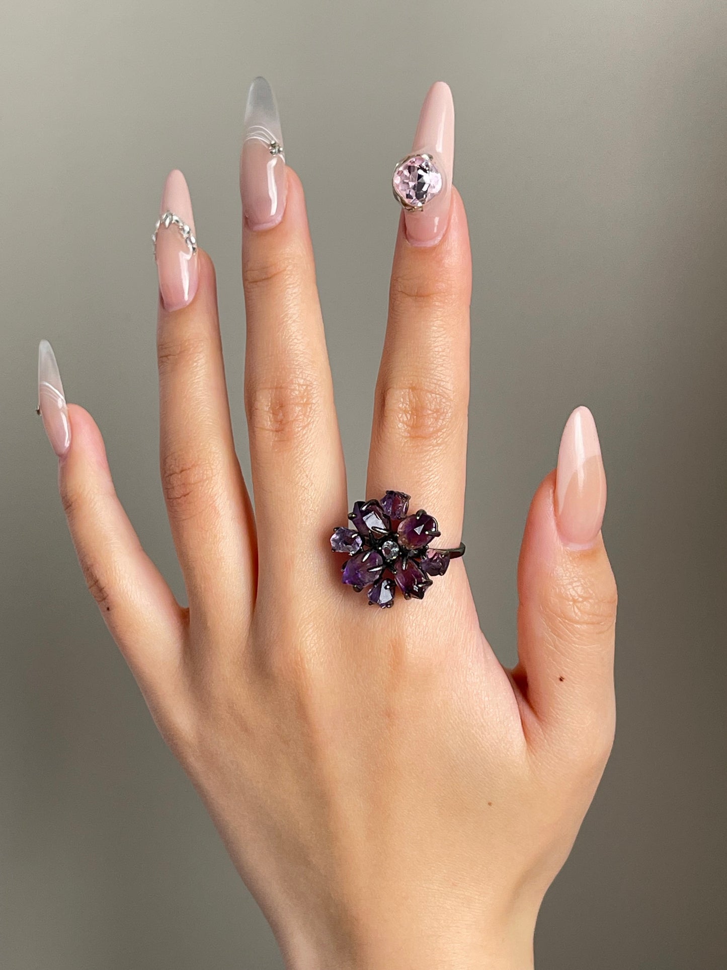 super seven amethyst crystal blossom ring worn on hand