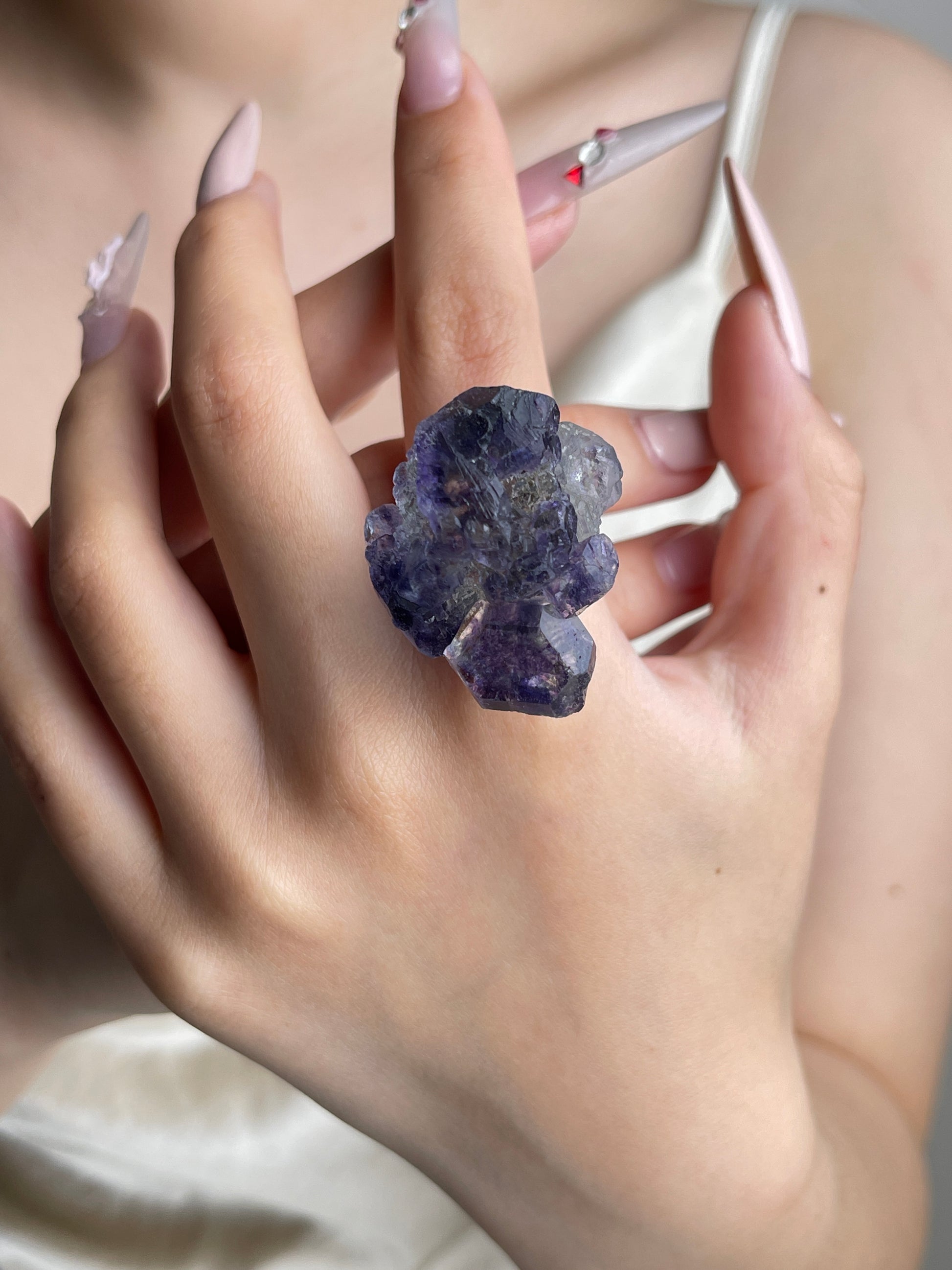 Raw Tanzanite Fluorite crystal ring worn on hand