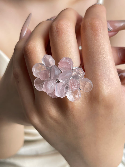 Close-up hand shot of Twin Bloom Rose Quartz and Strawberry Quartz Ring by Oryssia