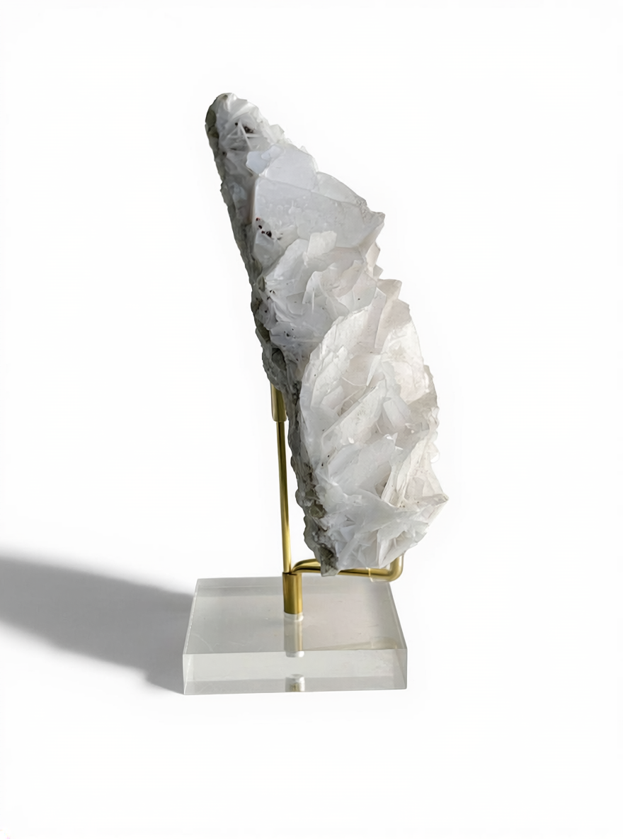 white rose calcite mineral specimen showing sculptural layered crystal structure side view